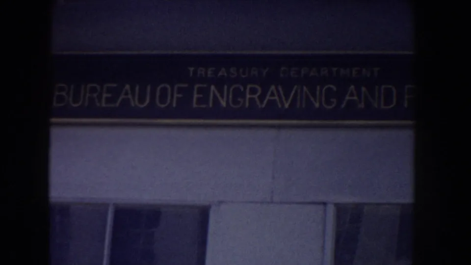 1960 Washington, DC frame showing the Bureau of Engraving and Printing sign beneath the equestrian monument view.