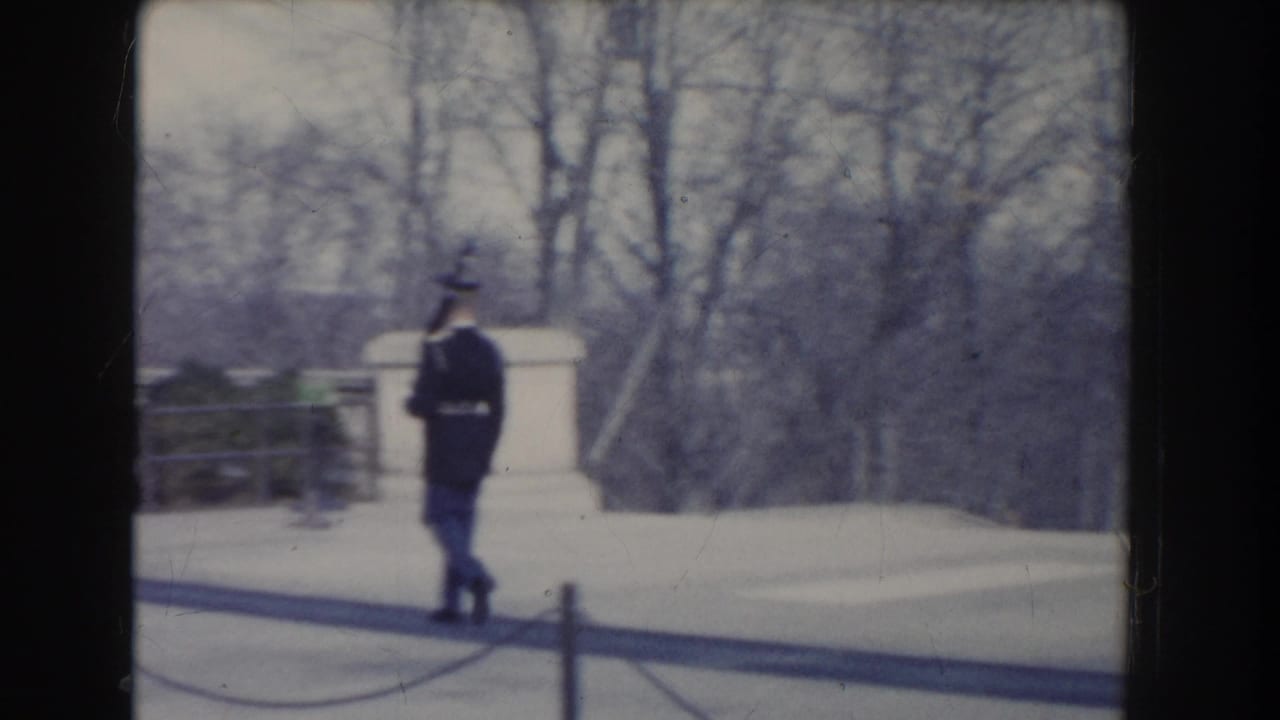 1960 Washington, DC footage appears to show a uniformed soldier walking across paved monument grounds in cold-season light.