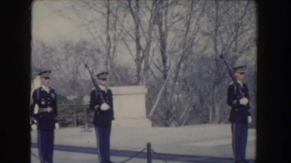 1960 Washington, D.C. home-movie footage shows three military guards spaced along a ceremonial walkway near a monument.