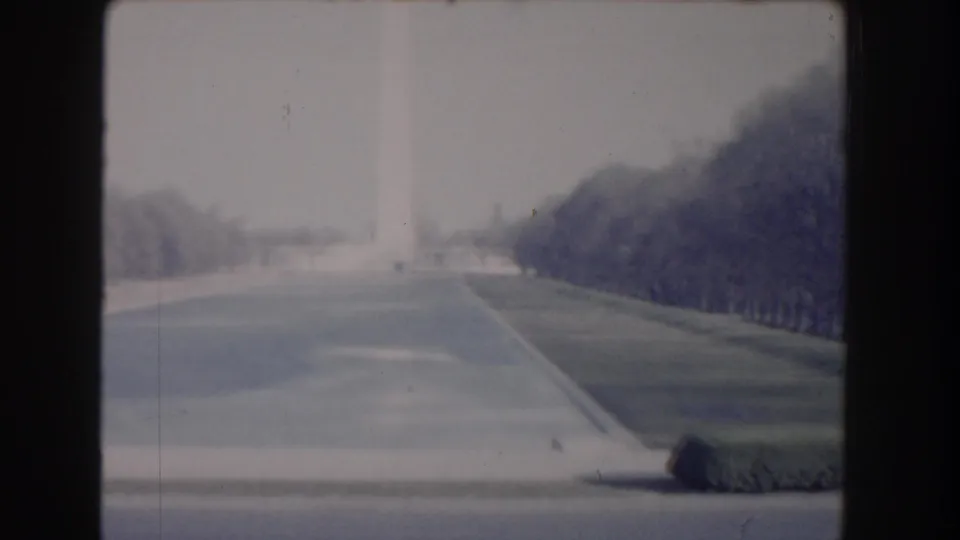 1960 Washington, DC home-movie frame looking along the Reflecting Pool toward the Washington Monument on the National Mall.
