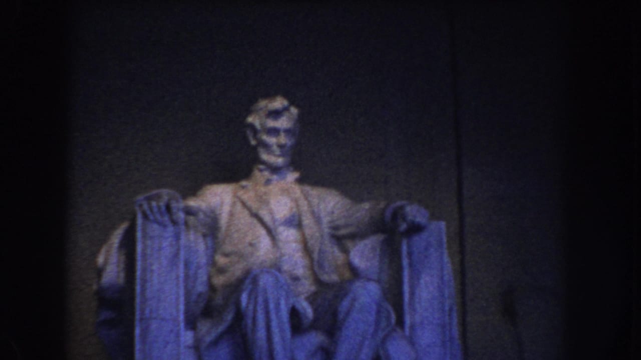 1960 Washington DC frame with the seated Lincoln statue more clearly lit against the Lincoln Memorial interior wall.
