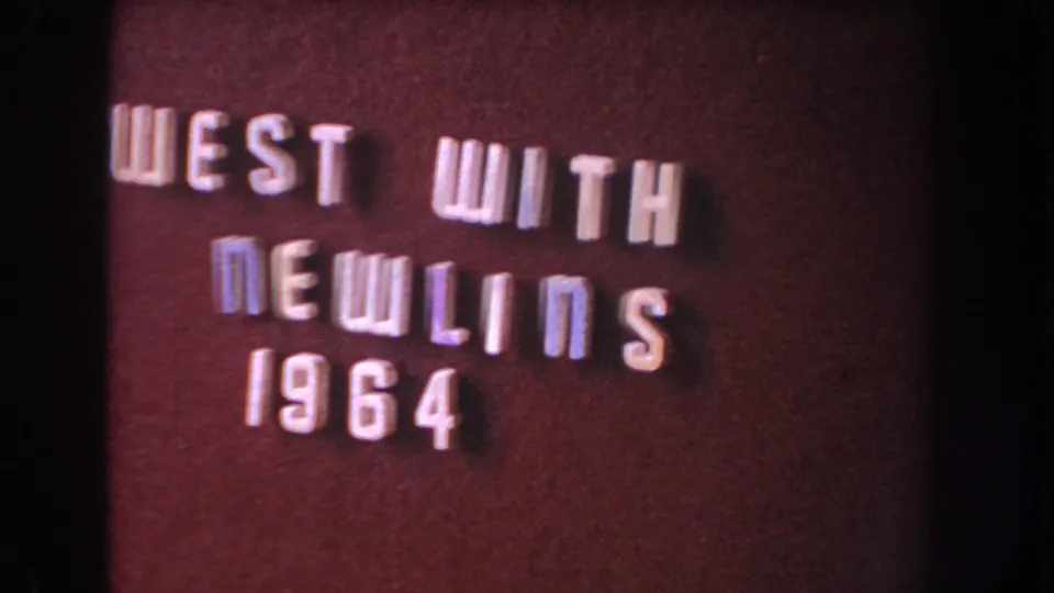 Dark red-brown 8mm title card reading West With Newlins 1964, likely from a related or subsequent home-movie reel segment.