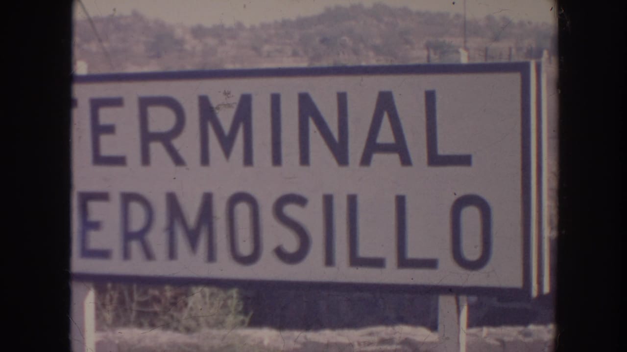 1961 8mm frame with the Terminal Hermosillo sign filling most of the view, cropped at the left edge.