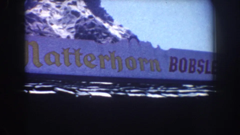 1962 Anaheim frame with gold Matterhorn lettering and purple Bobsleds text below the snowy mountain facade.