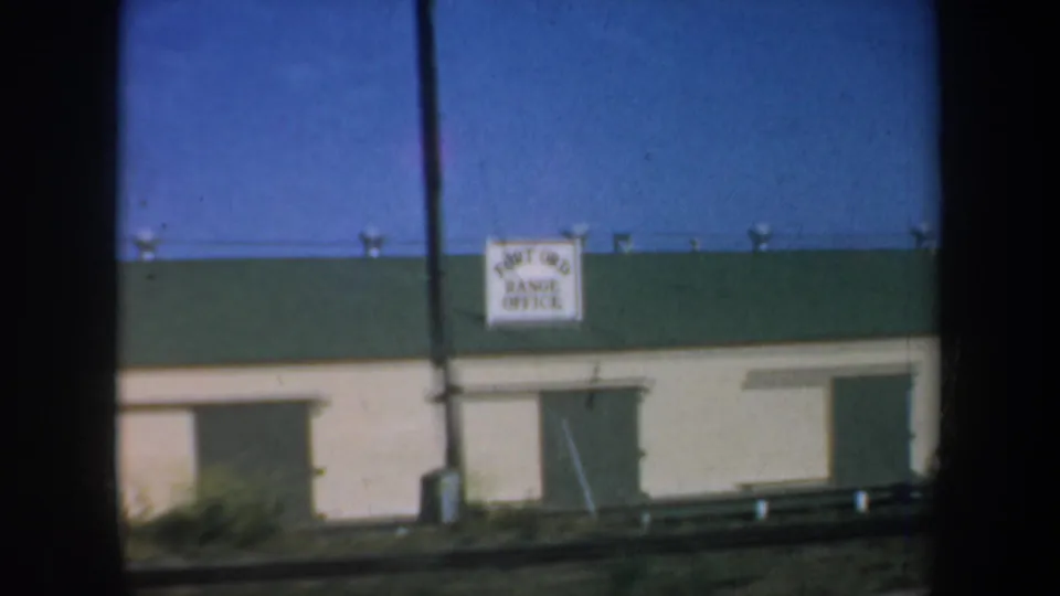 Low roadside building in the 1957 San Francisco footage, with a visible sign reading Port of San Francisco Office.