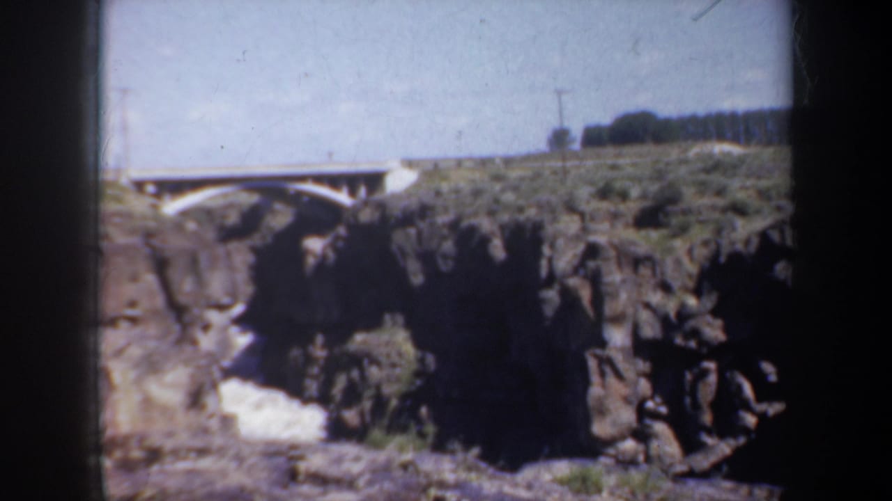 Bridge and cliff edge seen from a steady overlook viewpoint.