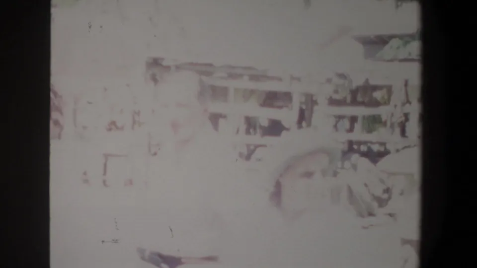 Overexposed Pretoria market frame with a figure near the right side and faint stall details behind them.