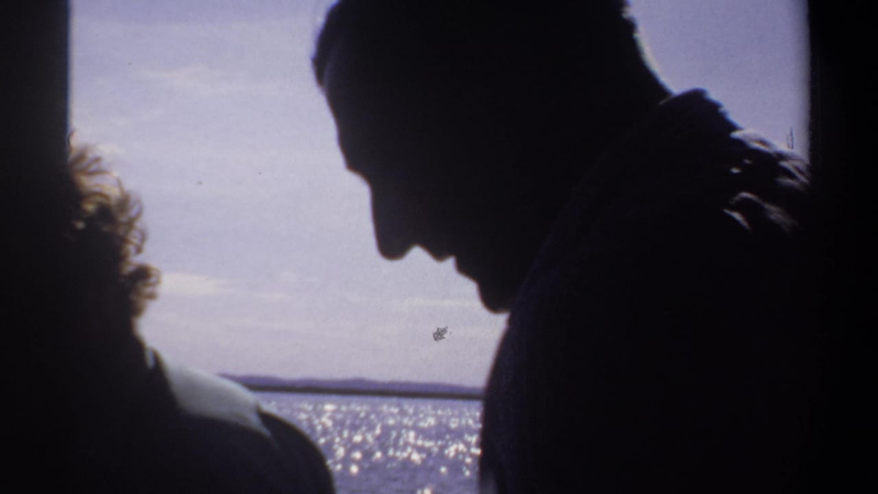 Silhouetted figures on a boat in Khartoum, Sudan, appear against sunlit water in 1969 home-movie footage.