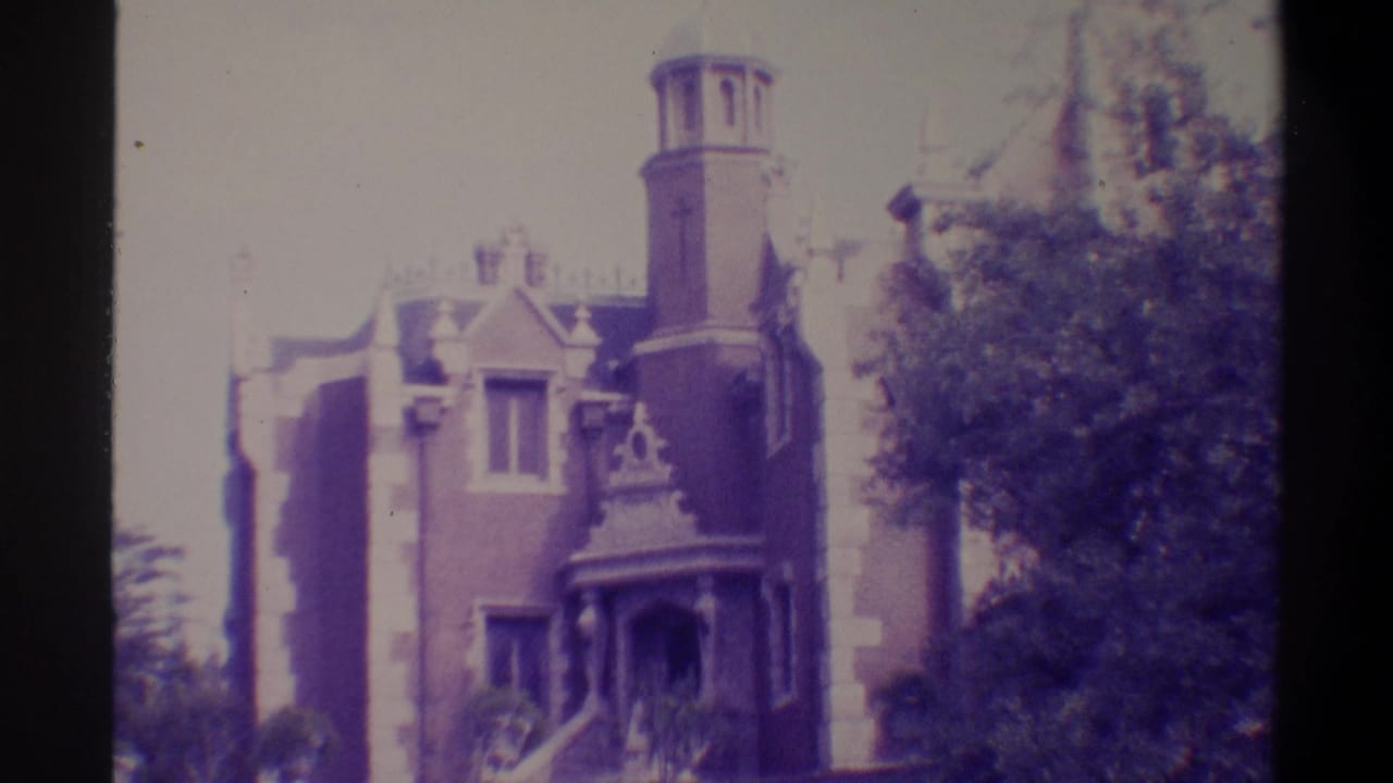 Gothic Revival brick building, possibly Gainesville, Florida, 1974 — cylindrical tower, ornate porch, summer trees; characteristic 8mm purple color shift.