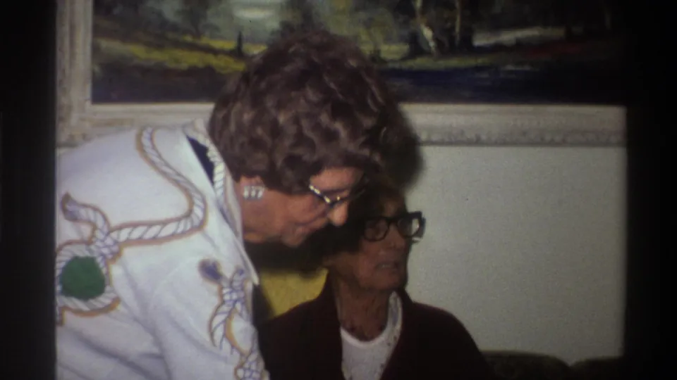 Closing frame of a 1975 Gainesville Florida home movie clip; warm 8mm film saturation and visible grain are most apparent in this frame.