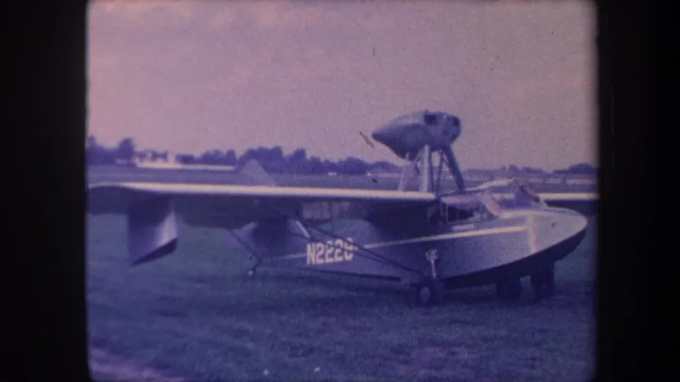 8mm home movie, c.1959, boat-hull amphibious aircraft (reg. N222U) on grass airfield, rear-quarter view, likely Yucaipa, California.