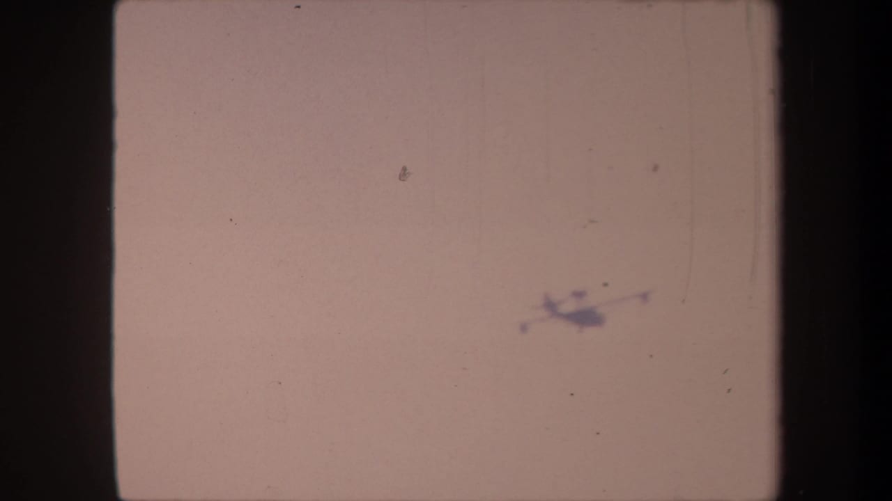 Aircraft silhouette moved to the upper-right of the faded 8mm frame in this circa 1959 California home movie.
