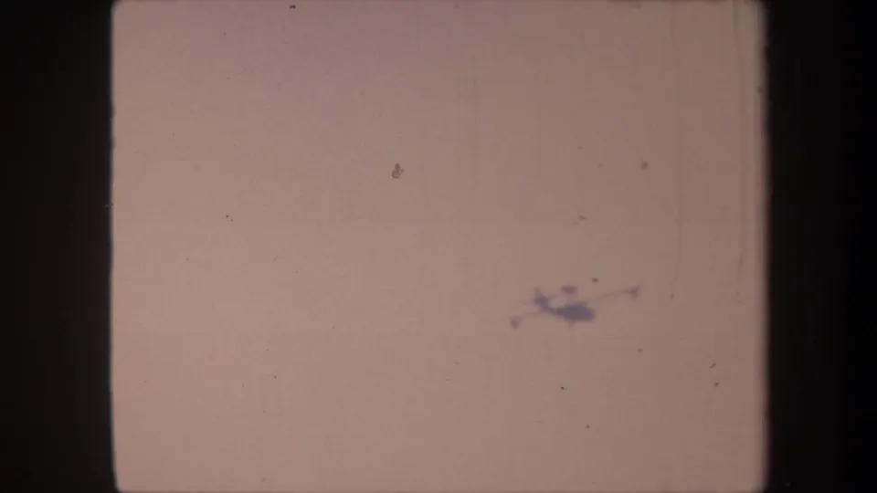 Aircraft silhouette moved to the upper-right of the faded 8mm frame in this circa 1959 California home movie.