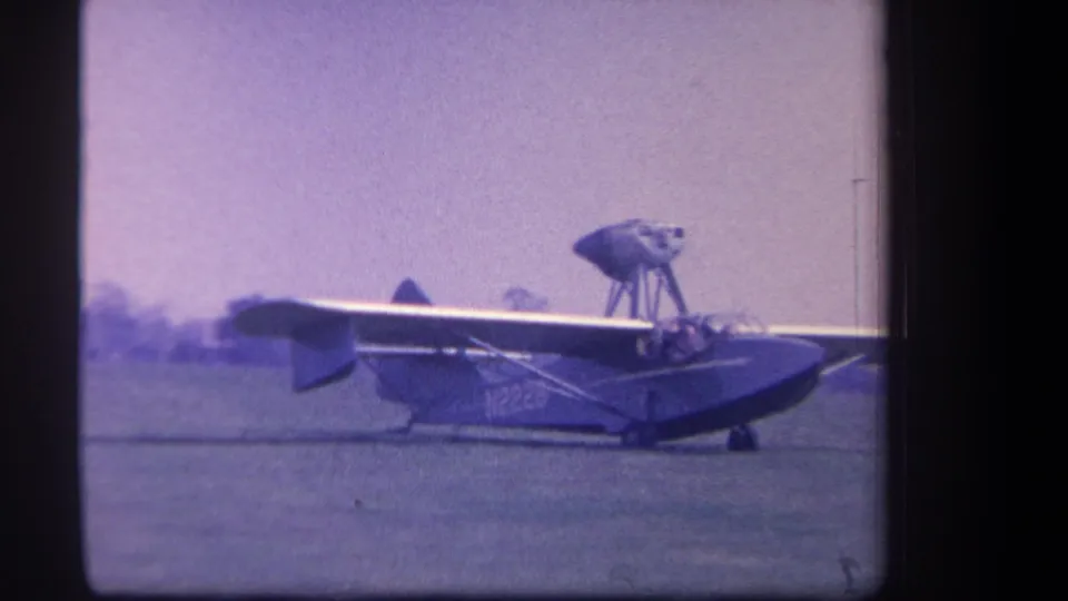 Final frame of the Yucaipa airfield shot, showing the amphibious aircraft continuing its taxi across the open grass field.