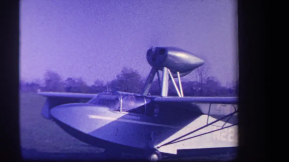 Yucaipa, California 1959 frame showing the aircraft idling in profile, with rounded fuselage, high nacelle, and soft 8mm texture.