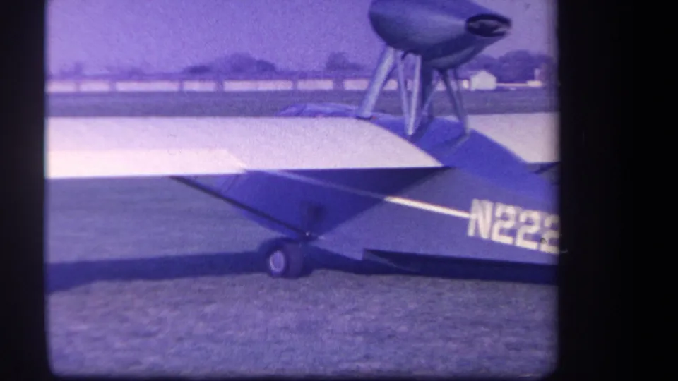 1959 Yucaipa-area frame of the small aircraft's tail, wing, and wheel, with part of the N2228 registration visible.