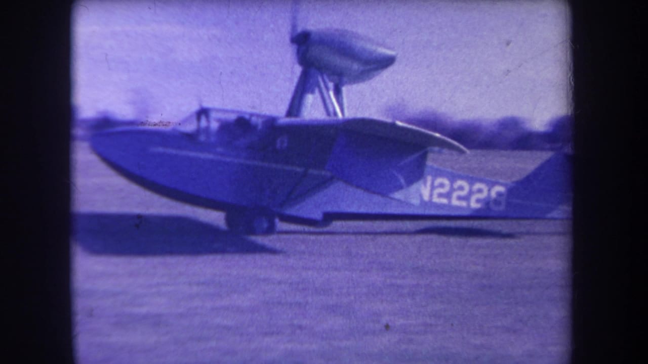 The blue-and-white amphibious plane marked N2226 is filmed from the side on the Yucaipa airfield in 1963.