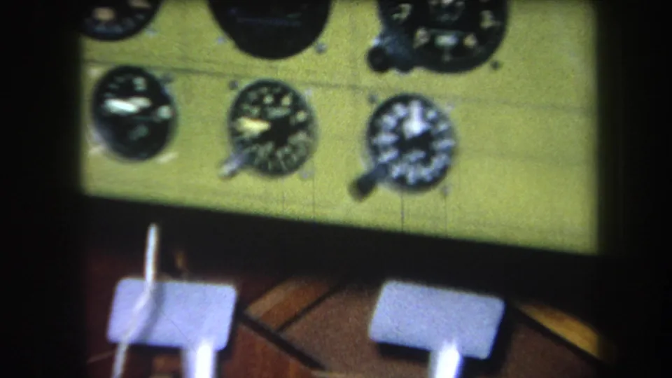 A zoomed 1964 home-movie frame isolates the aircraft instrument cluster on the green panel, with the foot controls blurred below.