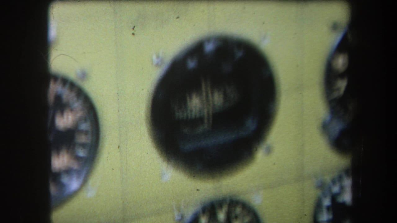 Yellow control surface with a large round dial and a partial dial at the edge.