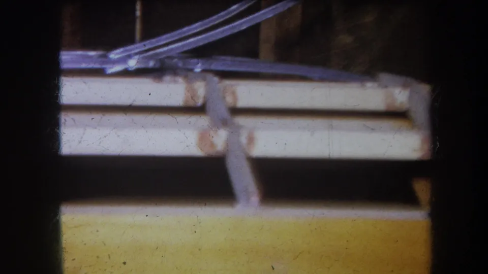1964 Yucaipa frame with soft-focus tubing, a pale rail, and yellow board on the same homemade mechanical device.