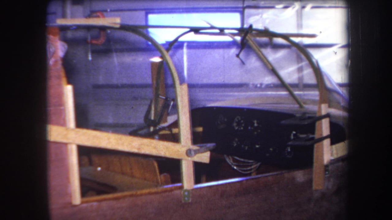 1964 Yucaipa footage shows the custom cockpit from a similar angle, with the canopy arching over a black gauge panel.