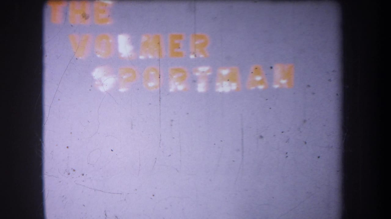 1965 8mm frame from Volmer, Yucaipa, with faint red and white lettering reading The Volmer Sportsman near the top.