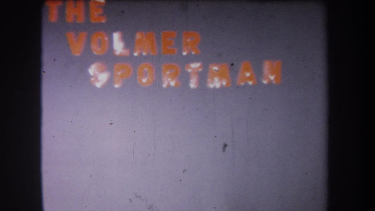 Faded orange text reading THE VOLMER SPORTSMAN on a grey background.