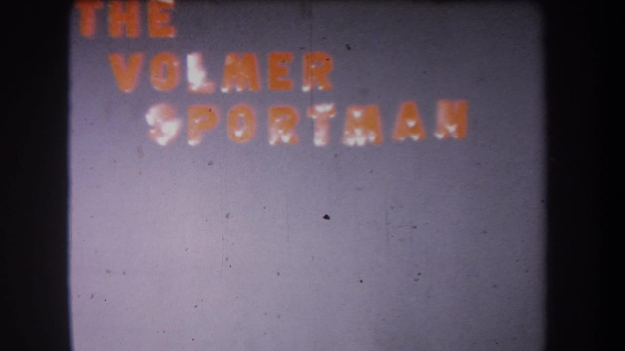 1965 Volmer Yucaipa 8mm still with orange THE VOLMER SPORTSMAN text set high in the frame and visible film wear.