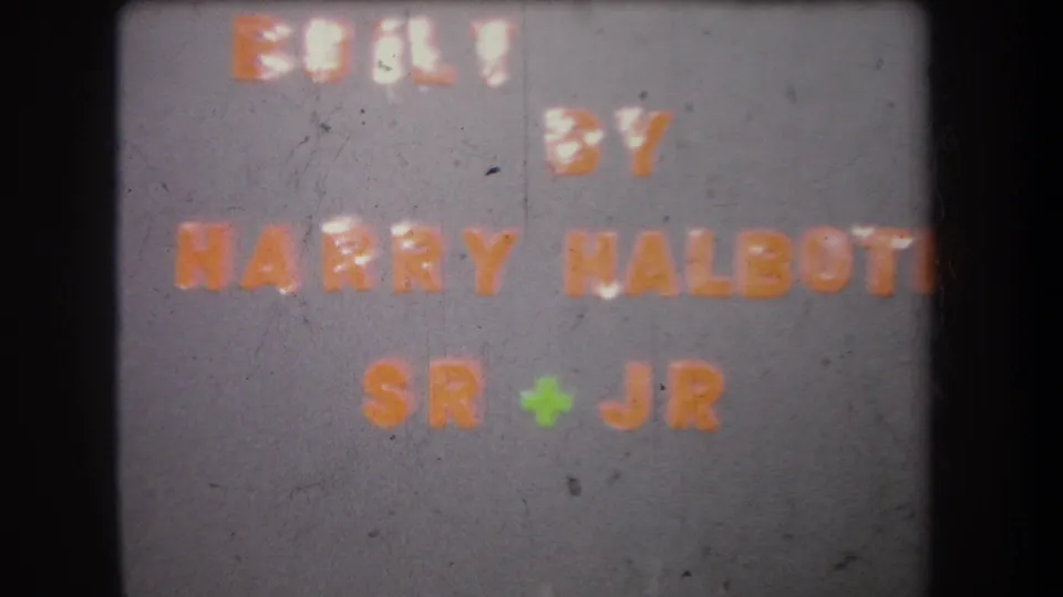 Volmer Yucaipa 1965 home-movie title frame showing BUILT BY HARRY HALBOTT SR + JR with visible 8mm grain.