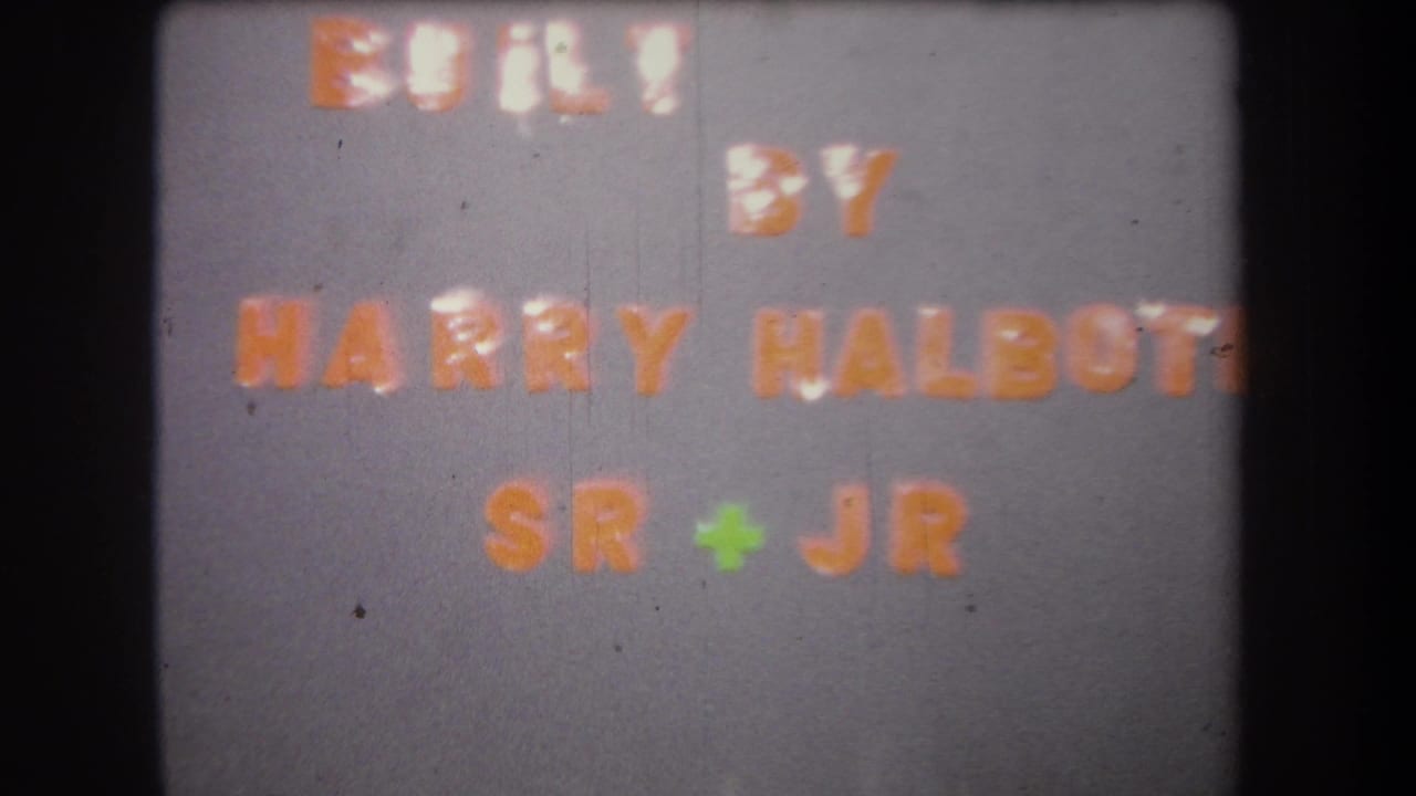 Repeated 1965 project title card naming Harry Halboti Sr and Jr, shown with faded 8mm color and soft focus.
