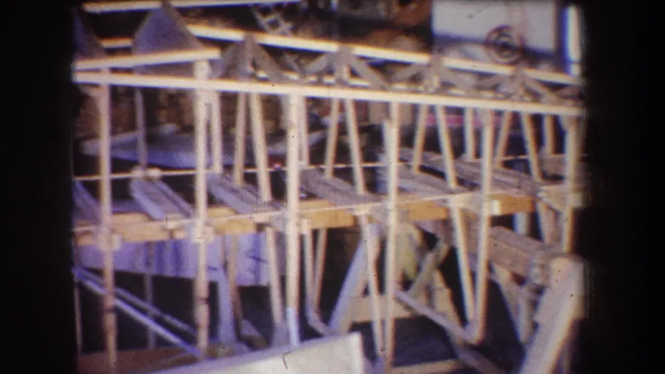 The final 1965 Yucaipa frame presents a wider section of the workshop structure with repeated wood supports and triangular bracing.