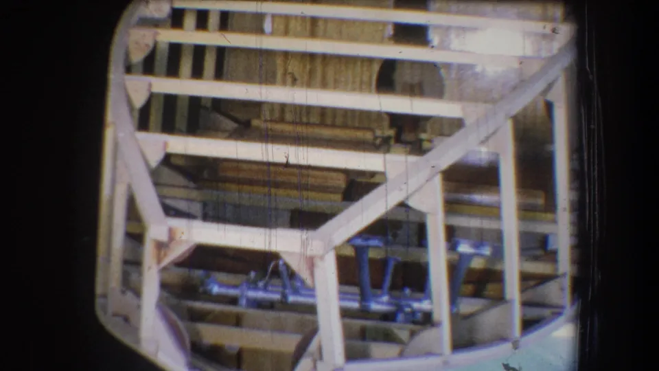 Final frame shows the same unfinished wooden boat interior, with pale framing, blue seats, and visible 8mm wear.