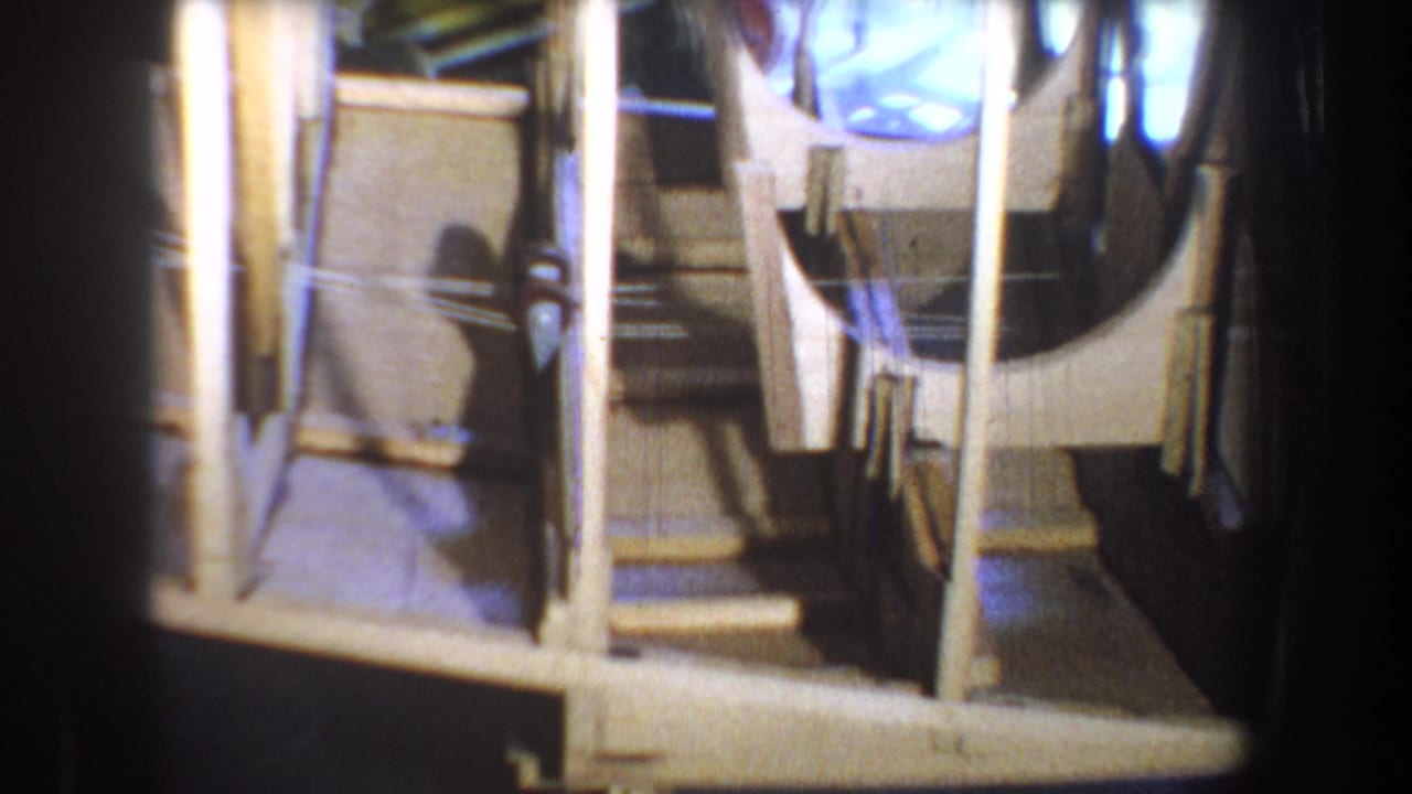 Close 1965 view of homemade boat framing, with pale ribs and internal supports filling most of the frame.