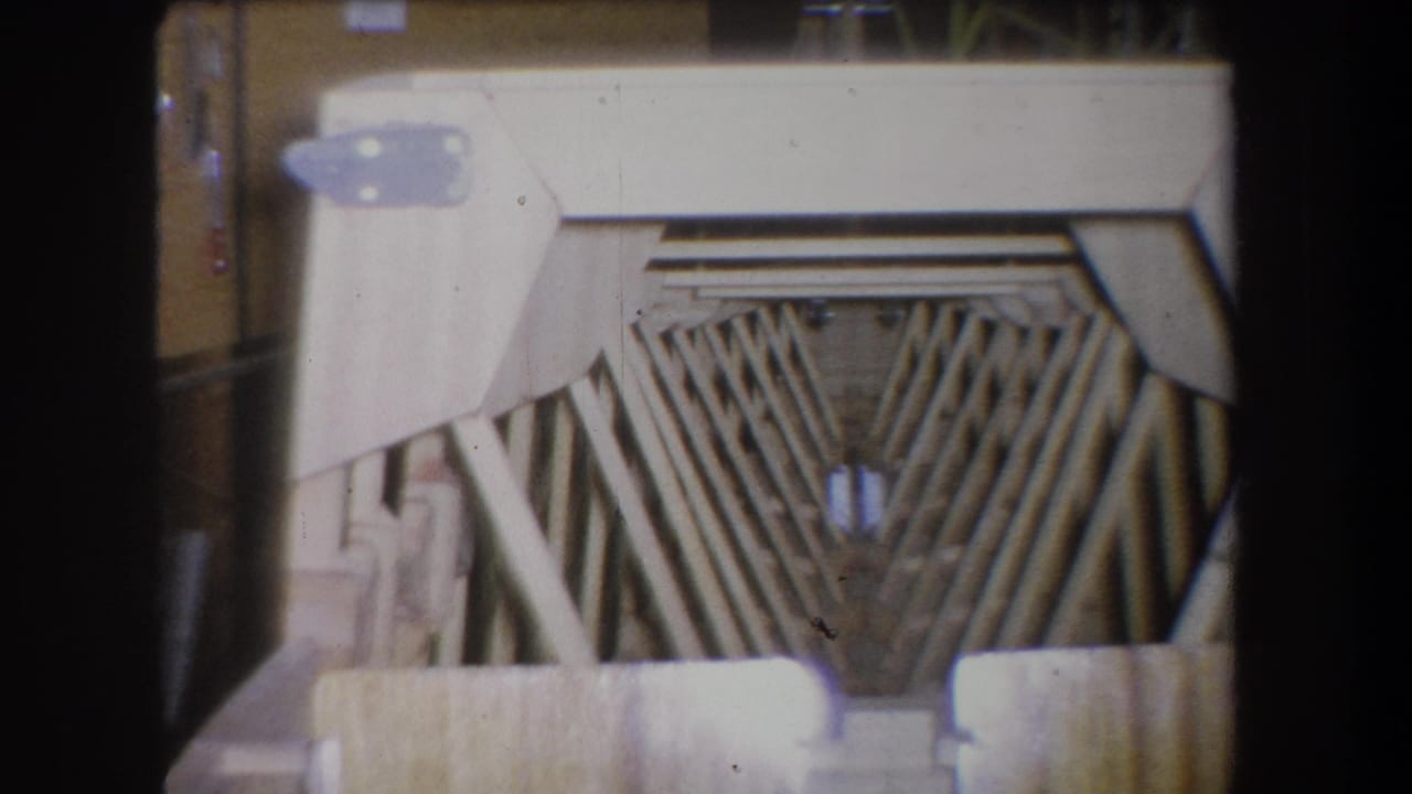 1965 Yucaipa home-movie frame with a fan-shaped wooden slat pattern and silver-toned metal components.