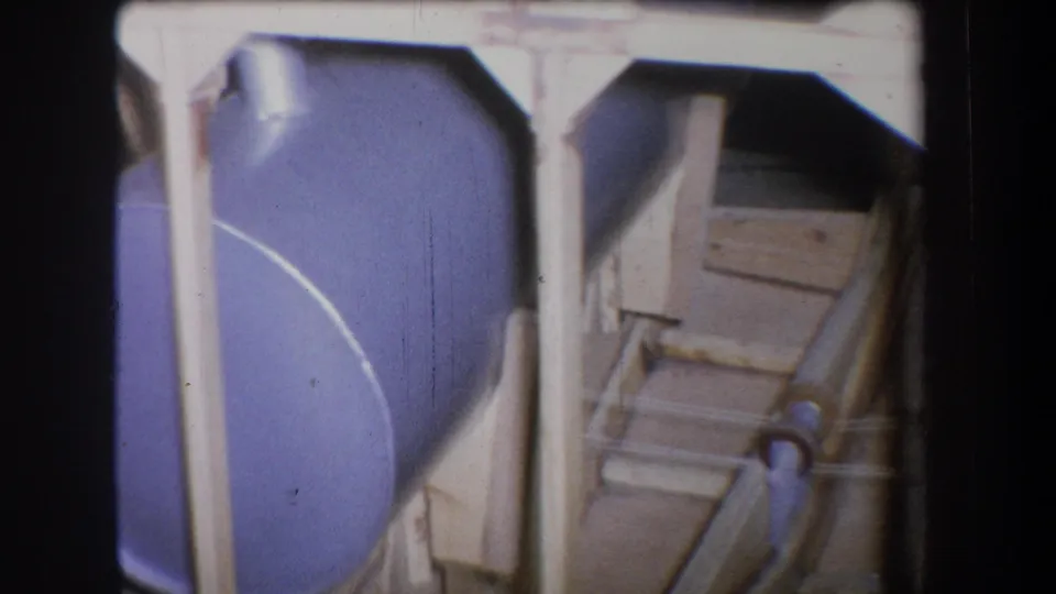 1965 Yucaipa frame showing the drum at left and a wooden mechanical framework with metal rods and shaded recesses at right.