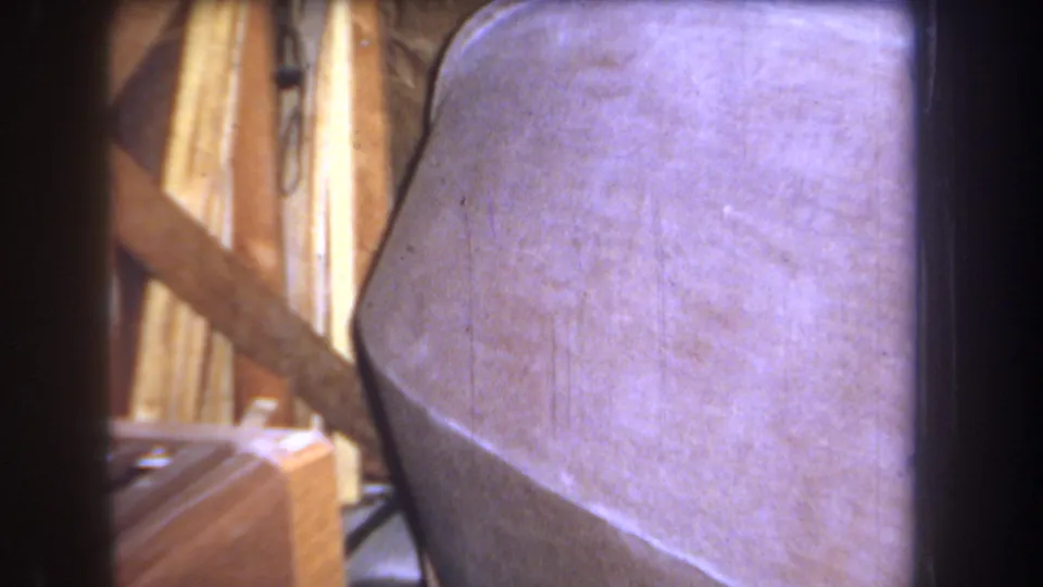 A light curved sanded surface fills the frame beside upright wood pieces, suggesting a home project detail after the title card.