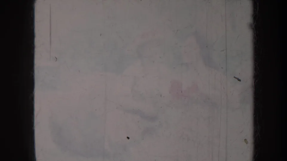Damaged 1967 Honolulu home-movie frame showing barely legible adults, with a possible handshake hidden by grain and fading.