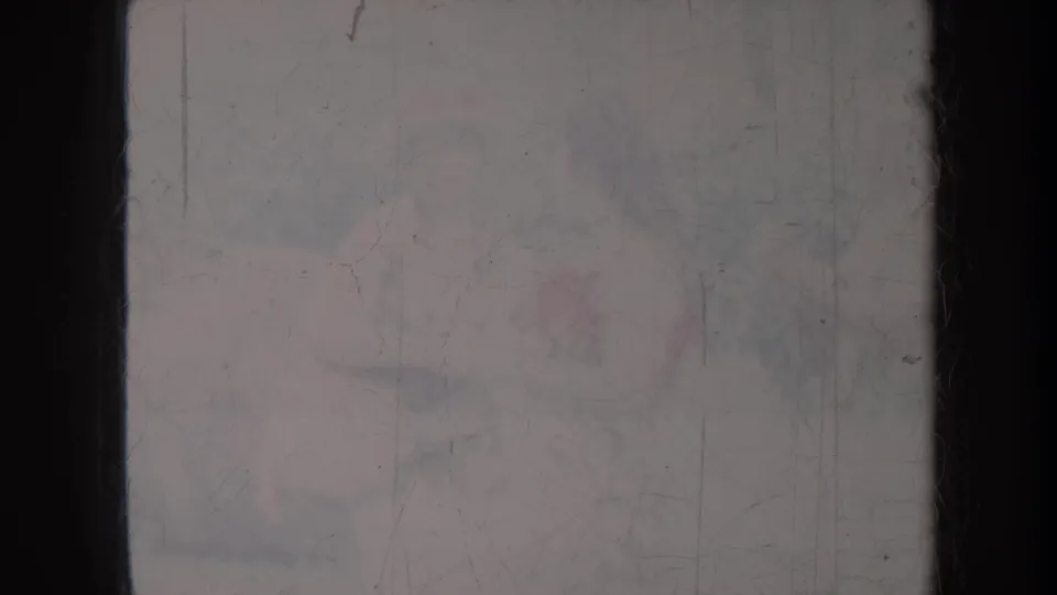 Faded 1967 Honolulu 8mm frame with barely visible outdoor forms obscured by scratches, dust, and low contrast.