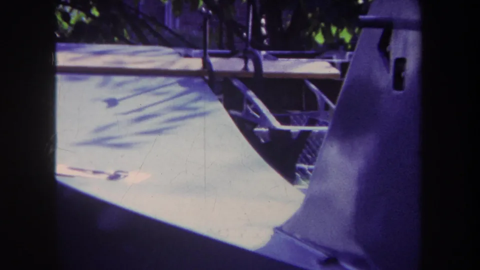 The final frame looks from a dim interior toward a bright patio and backyard, with the man partly visible near the right side.