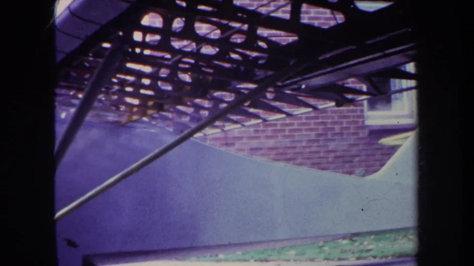 A closer 1969 view of the unfinished custom airplane, with its curved white fuselage and metal supports visible outdoors in Yucaipa.