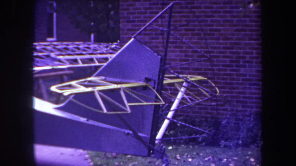A 1969 archival frame shows a homebuilt sailplane or aircraft under construction, with tubular supports and fabric-covered surfaces.