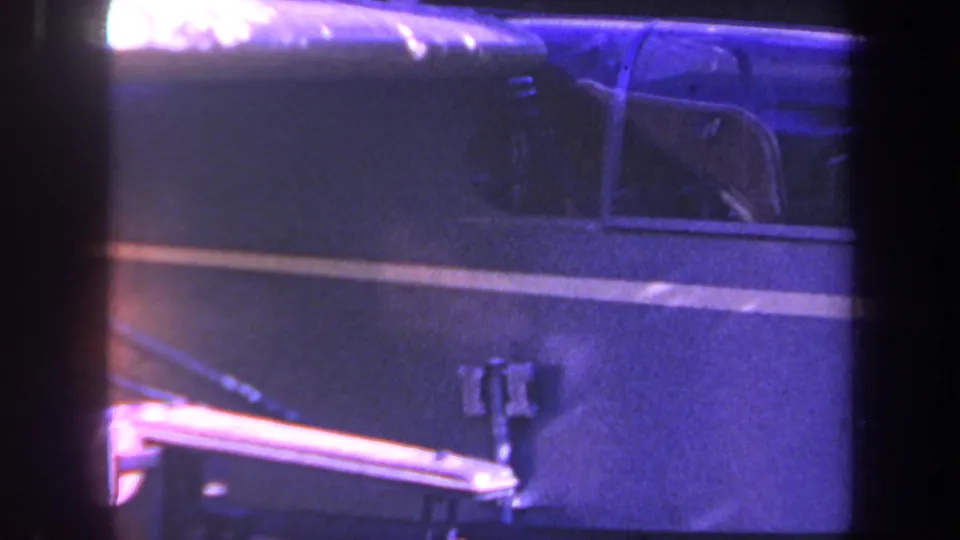 Final 1969 Yucaipa-area frame showing a blue aircraft side panel, small window outline, struts, and landing gear hardware.