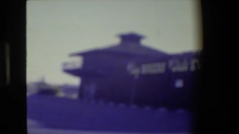 Soft 8mm frame showing the Roy Rogers and Dale Evans Museum building from the parking area in San Francisco, California.