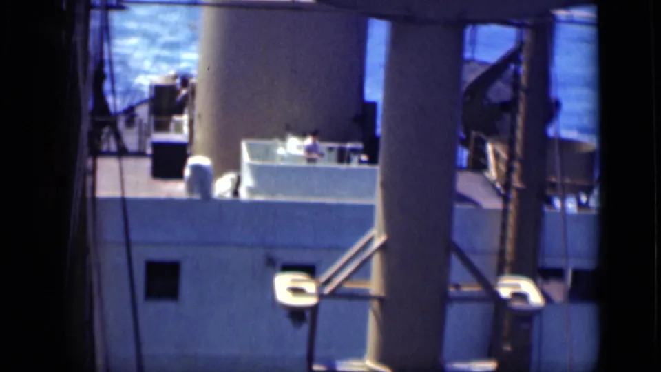 Large ship at sea in 1946 Cairo, Egypt footage, seen through a dark frame with funnel, railings, rigging, and deck details.
