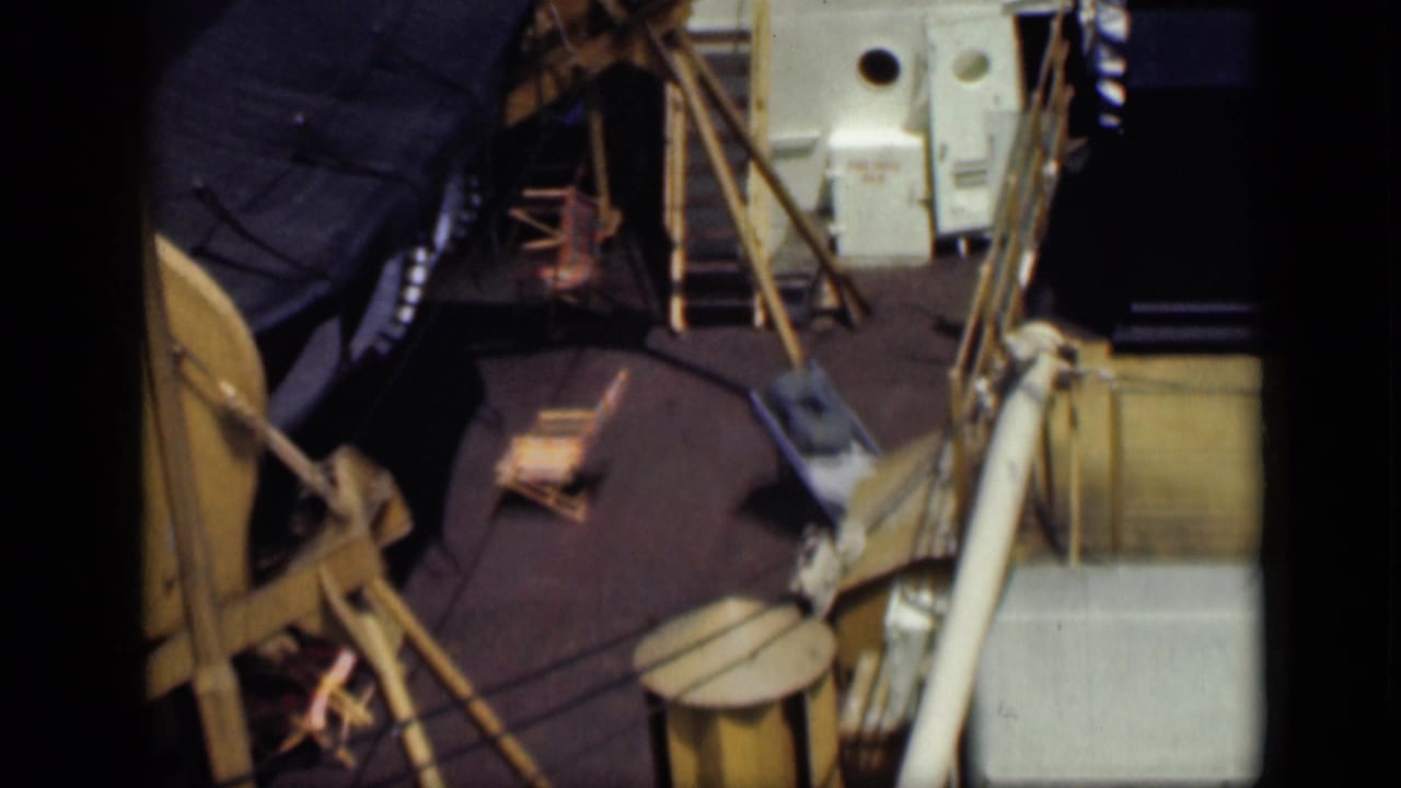 1946 Egypt travel-reel frame showing a ship deck with barrels, poles, rope, and deck equipment viewed from above.