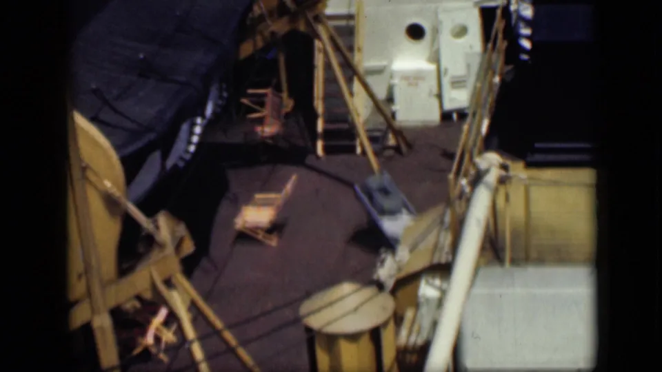 1946 Egypt travel-reel frame showing a ship deck with barrels, poles, rope, and deck equipment viewed from above.