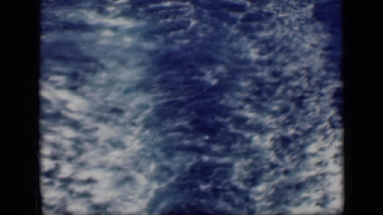 The 1946 Cairo, Egypt reel shows churning blue water and wake from a ship, with only a narrow vessel edge visible along the side.