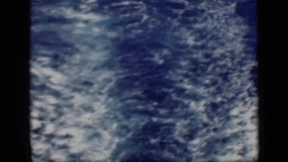 The 1946 Cairo, Egypt reel shows churning blue water and wake from a ship, with only a narrow vessel edge visible along the side.