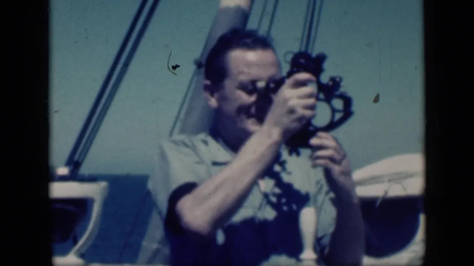 Close shipboard view from the 1946 Cairo footage with a man measuring through a sextant on deck.
