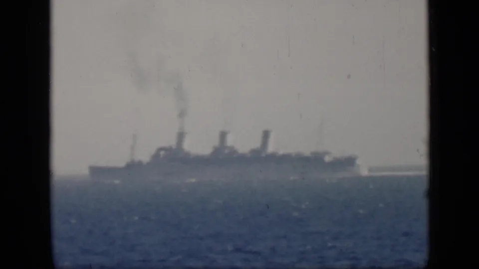 End frame of the 1946 Egypt-linked 8mm clip showing the large steamship still distant on the water.